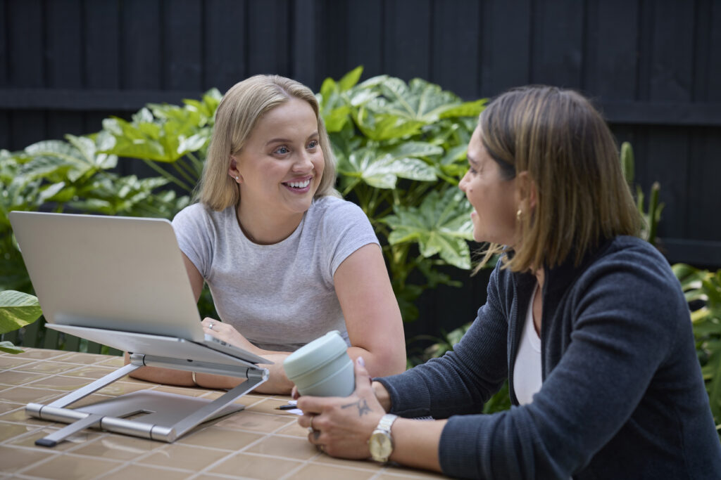 Two female students discussing their study journey